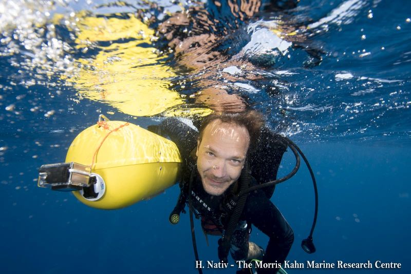 Scientific diver with the AUV (Automated Underwater Vehicle)